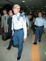 Japanese police officers return from E. Timor